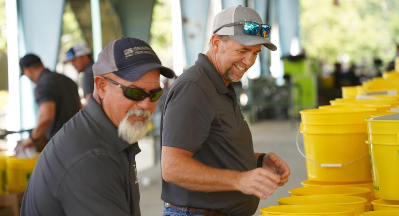 SSEMC Employees prepare buckets for members