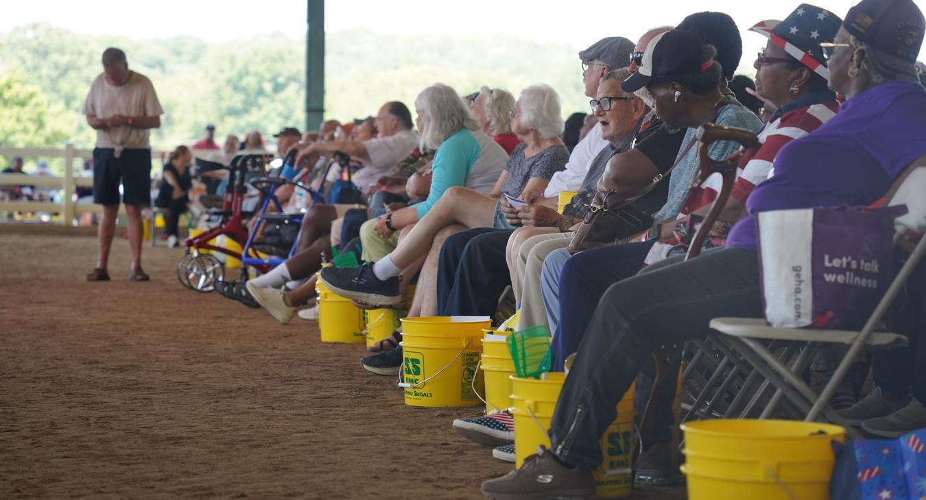 Members sit during meeting