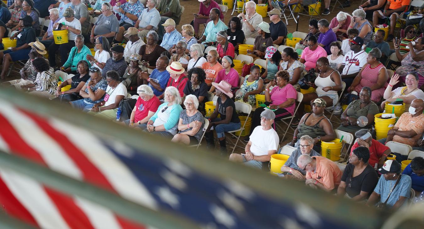 Members sit during meeting