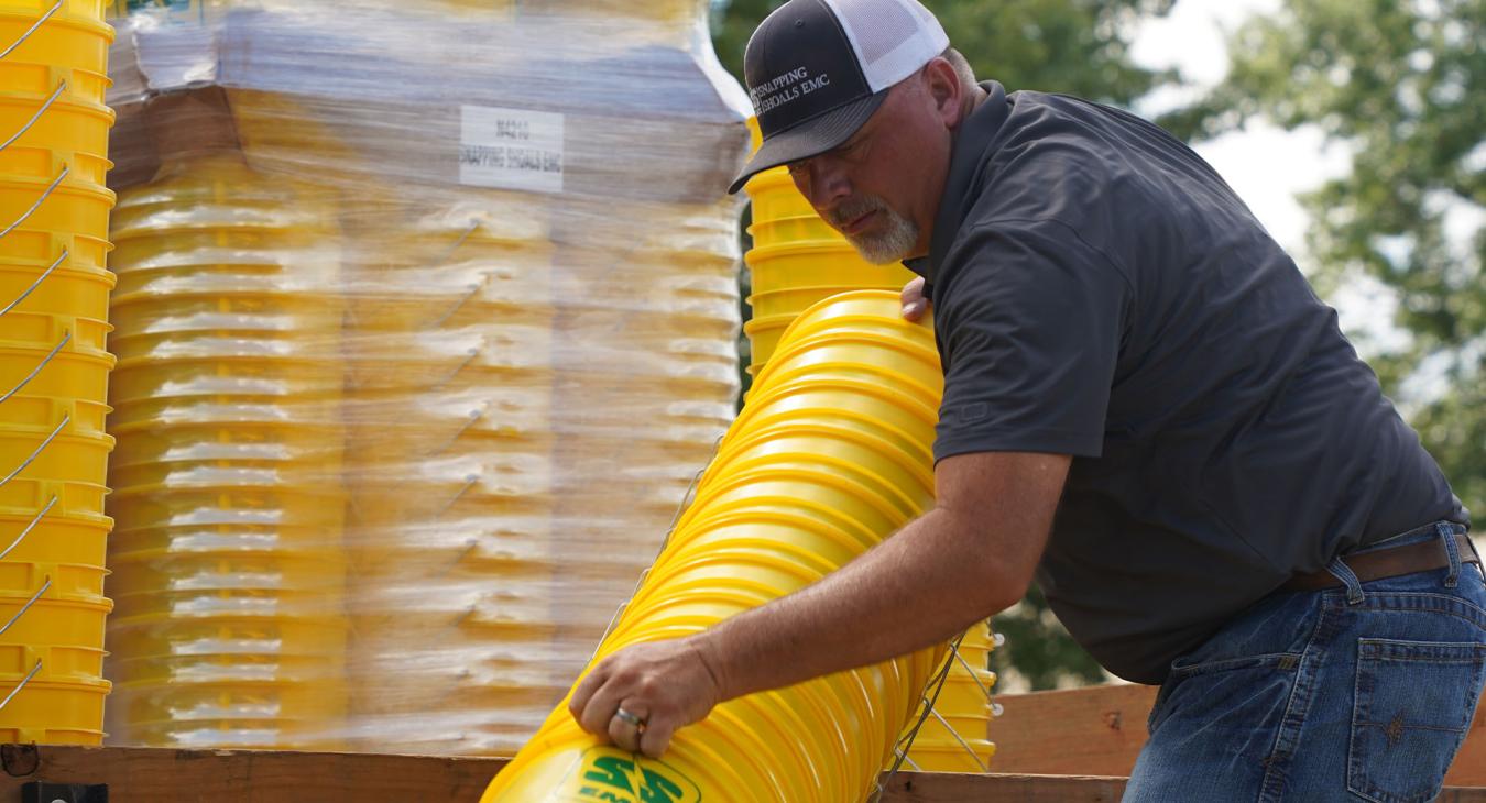SSEMC Employee prepares buckets